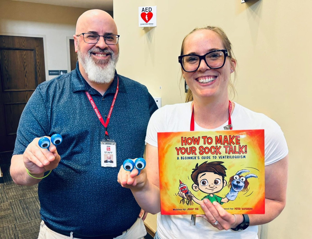 Two educators holding How to Make Your Sock Talk